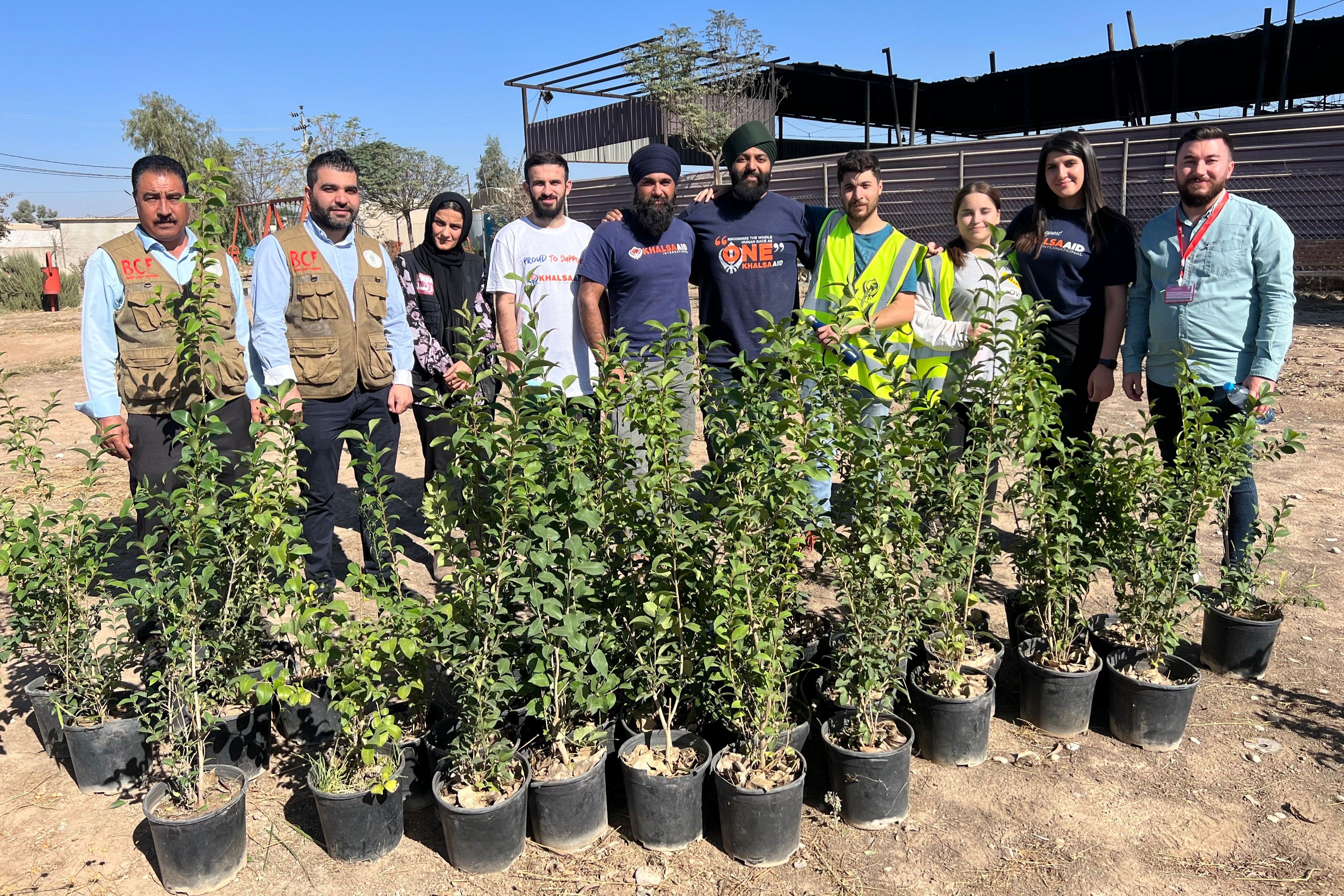 Khalsa Aid coordinators and volunteers with the trees to be planted for Planting Memories.