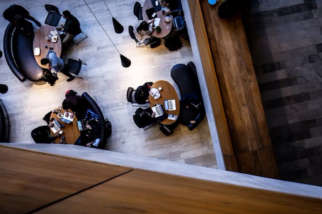 Credit: Jordan Encarnacao on Unsplash.com. 'aerial photography of people sitting on chair' https://unsplash.com/photos/aerial-photography-of-people-sitting-on-chair-c0rplvWqyZk